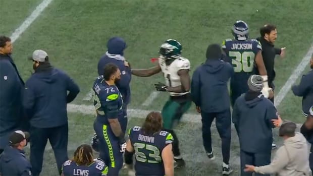 Eagles wide receiver A.J. Brown makes contact with a Seahawks staff member during Week 15.